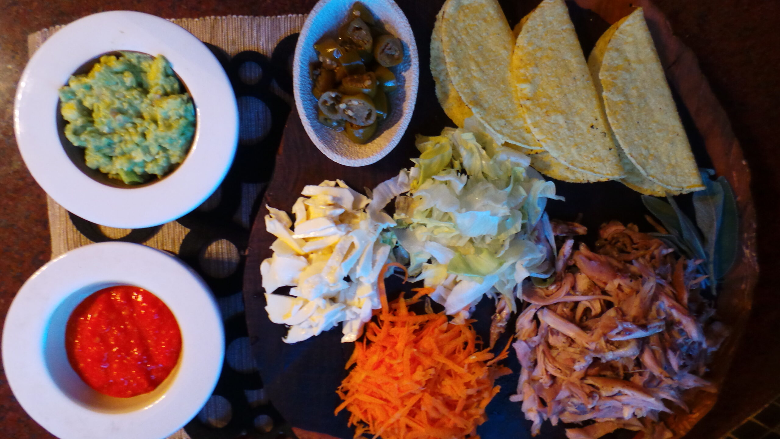 Crispy Tacos stuffed with a Roasted Chicken filling, guacamole and a mix of crunchy, fresh salads